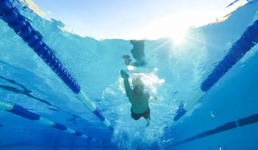 practicing laps in a pool for a triathlon