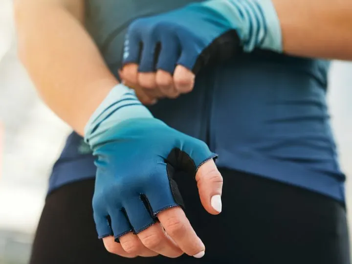female cyclist wearing cycling gloves