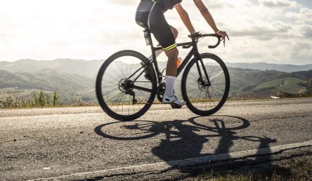 cyclist on road with a road bike