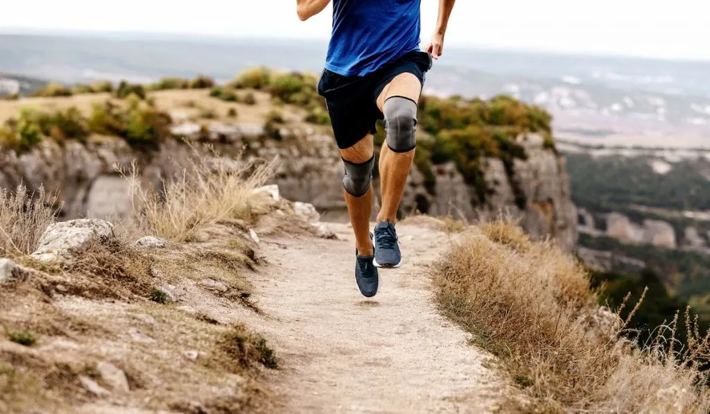 male runner run mountain trail