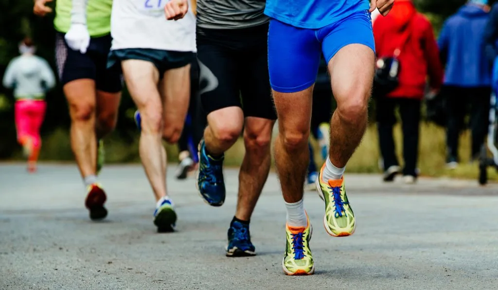 Cropped photo of Group Men Runners