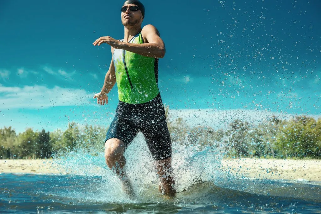 Professional triathlete getting ready to swim in the river