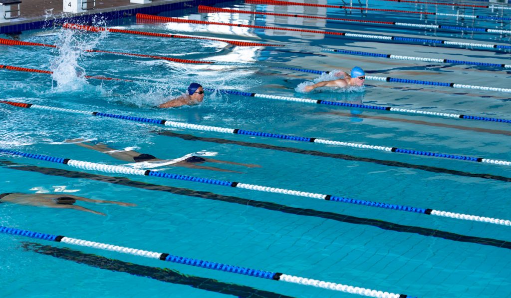 Swimmers racing in the pool