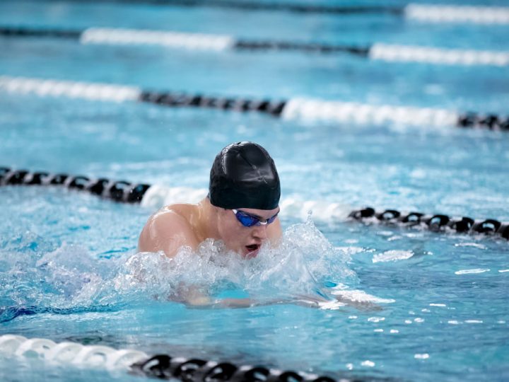 Young-male-swimming-swims-regular-breaststroke-in-the-pool